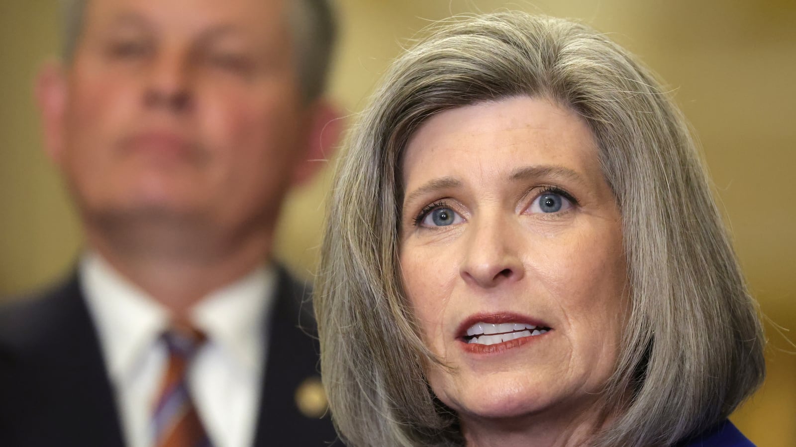 U.S. Sen. Joni Ernst (R-IA) speaks as Sen. Steven Daines (R-MT) listens during a news briefing after a weekly Senate Republican policy luncheon at the U.S. Capitol on July 9, 2024 in Washington, DC. Senate GOPs held a weekly policy luncheon to discuss Republican agenda.