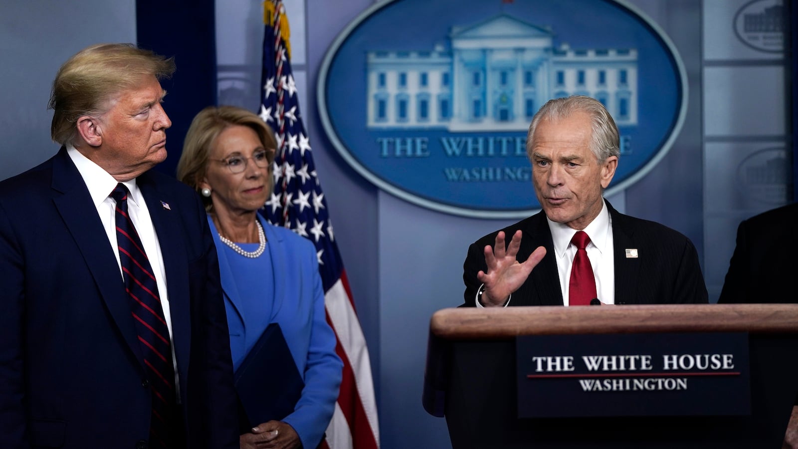 White House Trade and Manufacturing Policy Director Peter Navarro speaks as U.S. President Donald Trump and Secretary of Education Betsy DeVos during a briefing on the coronavirus pandemic in the press briefing room.