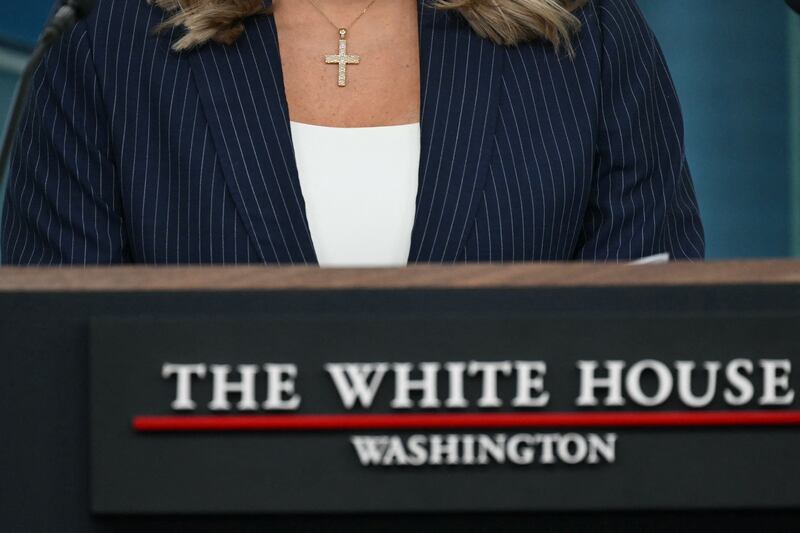 White House Press Secretary Karoline Leavitt wears a cross as she speaks during the daily briefing in the Brady Briefing Room of the White House in Washington, DC, on February 12, 2025. (Photo by ANDREW CABALLERO-REYNOLDS / AFP) (Photo by ANDREW CABALLERO-REYNOLDS/AFP via Getty Images)