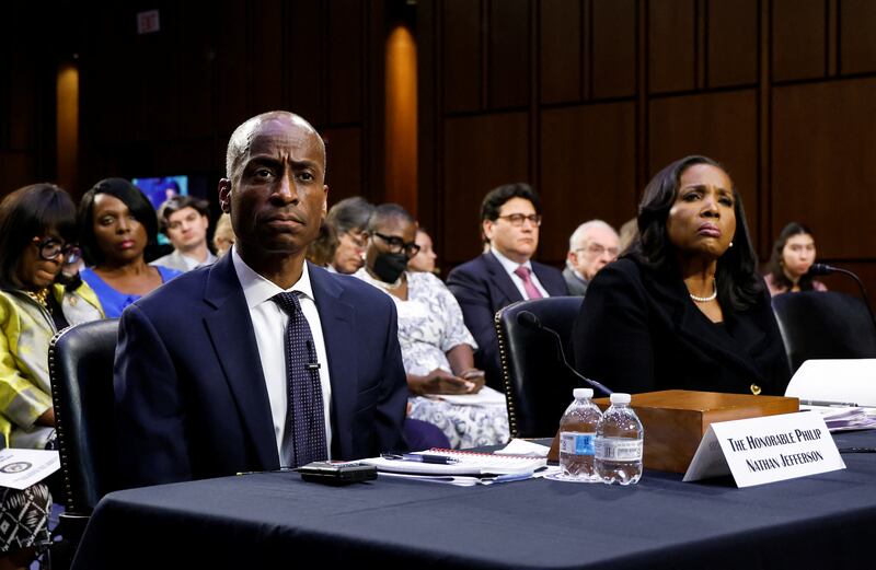 Federal Reserve Board of Governors Vice Chair Philip Jefferson and Lisa Cook testify in a Senate Banking Committee nominations hearing. Cook has filed suit after Trump fired her earlier this month.