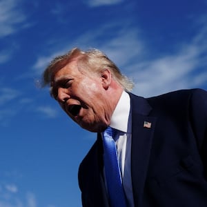 US President Donald Trump speaks to members of the media after exiting Air Force One at Chicago O’Hare International Airport, in Illinois, US, September 27, 2026. REUTERS/Nathan Howard