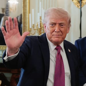 U.S. President Donald Trump waves as he departs after delivering remarks to NCAA Collegiate National Champions in the State Dining Room at the White House in Washington, D.C., U.S., April 21, 2026.