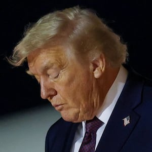 PALM BEACH, FLORIDA - DECEMBER 20: U.S. President Donald Trump walks off Air Force One at Palm Beach International Airport on December 20, 2025 in Palm Beach, Florida. Trump traveled to his Mar-a-Lago club after holding a rally in Rocky Mount, North Carolina. (Photo by Tasos Katopodis/Getty Images)