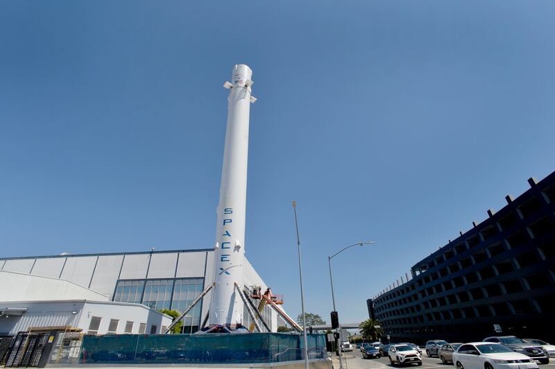 A SpaceX recovered rocket is displayed outside of the company's California headquarters in Hawthorne.