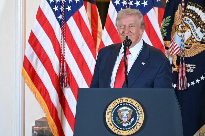 President Donald Trump reacts at the end of his speech to business leaders at the US ambassador's residence in Tokyo on October 28, 2025.
