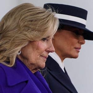 First lady Jill Biden walks with Melania Trump at the White House, on inauguration day of Donald Trump's second presidential term in Washington, U.S. January 20, 2025. REUTERS/Nathan Howard