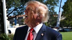 President Donald Trump speaks to the press before walking to board Marine One on the South Lawn of the White House in Washington, DC, on October 6, 2026.