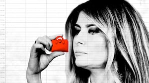 Melania Trump examines a tiny briefcase