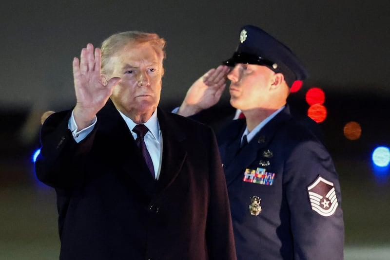 U.S. President Donald Trump gestures as he returns to Washington, at Joint Base Andrews in Maryland, U.S., March 15, 2026.