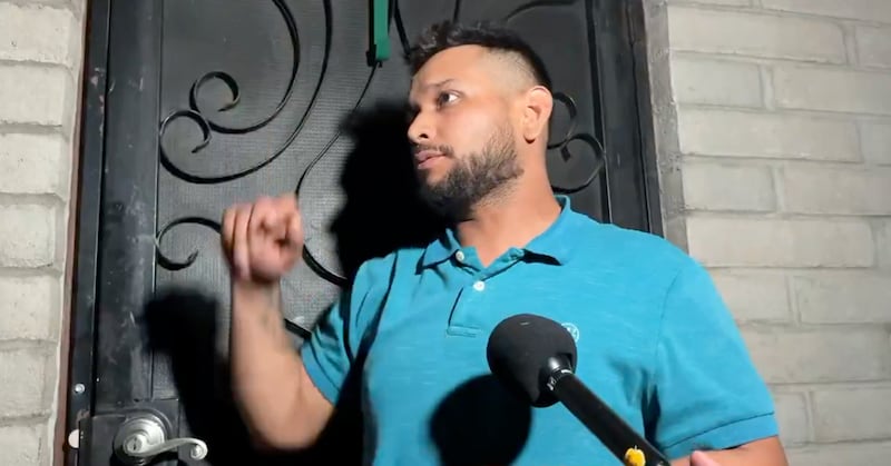 The man, identified as  Carlos Palazuelos, speaking to reporters outside his home.