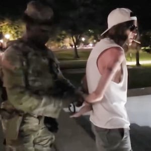 Three people are arrested by National Guards after a bizarre photo shoot at Donald Trump’s botched reflecting pool.