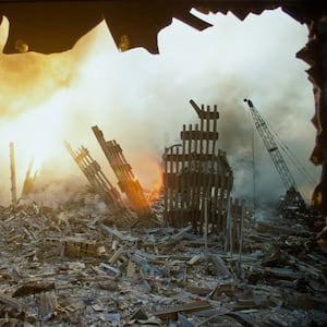 The rubble of the World Trade Center smolders following a terrorist attack September 11, 2001 in New York.