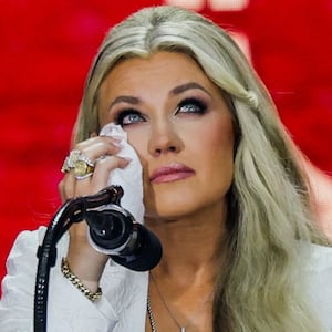 Erika Kirk, Charlie Kirk's widow, reacts as she speaks onstage during a memorial service for slain conservative commentator Charlie Kirk at State Farm Stadium, in Glendale, Arizona, U.S., September 21, 2025.  REUTERS/Daniel Cole
