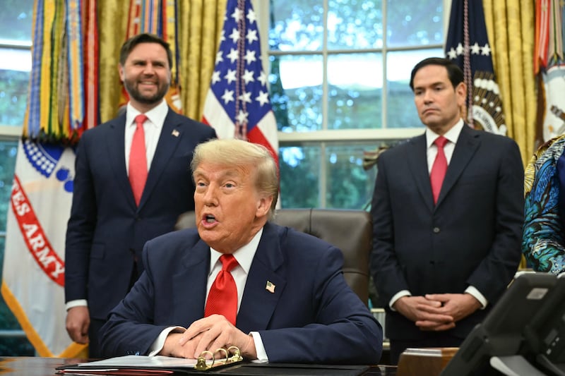 US President Donald Trump flanked by US Secretary of State Marco Rubio (R) and US Vice President JD Vance (L) speaks during a meeting with Democratic Republic of the Congo Foreign Minister Thérèse Kayikwamba Wagner and Rwandan Foreign Minister Olivier Nduhungirehe (not in frame) in the Oval Office of the White House in Washington, DC, on June 27, 2025. Rwanda and the Democratic Republic of Congo signed an agreement in Washington on Friday to put an end to a conflict in the eastern DRC that has killed thousands, although broad questions loom on what it will mean. Trump has trumpeted the diplomacy that led to the deal and publicly complained that he has not received a Nobel Peace Prize. But the agreement has also come under scrutiny for its vagueness including on the economic component, with the Trump administration eager to compete with China and profit from abundant mineral wealth in the long-turbulent east of the vast DRC. (Photo by ANDREW CABALLERO-REYNOLDS / AFP) (Photo by ANDREW CABALLERO-REYNOLDS/AFP via Getty Images)