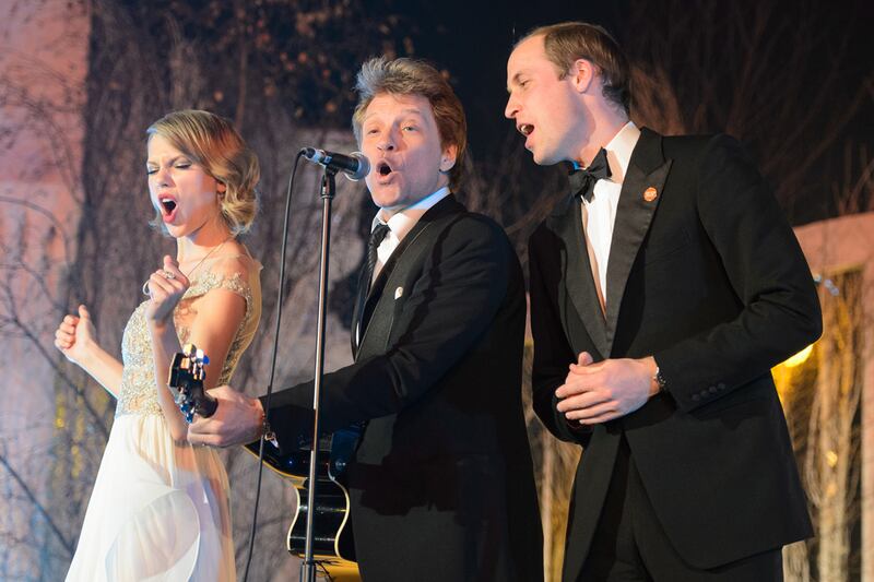 articles/2013/11/27/watch-prince-william-singing-livin-on-a-prayer-with-jon-bon-jovi-and-taylor-swift/william-jovi_rc9skd
