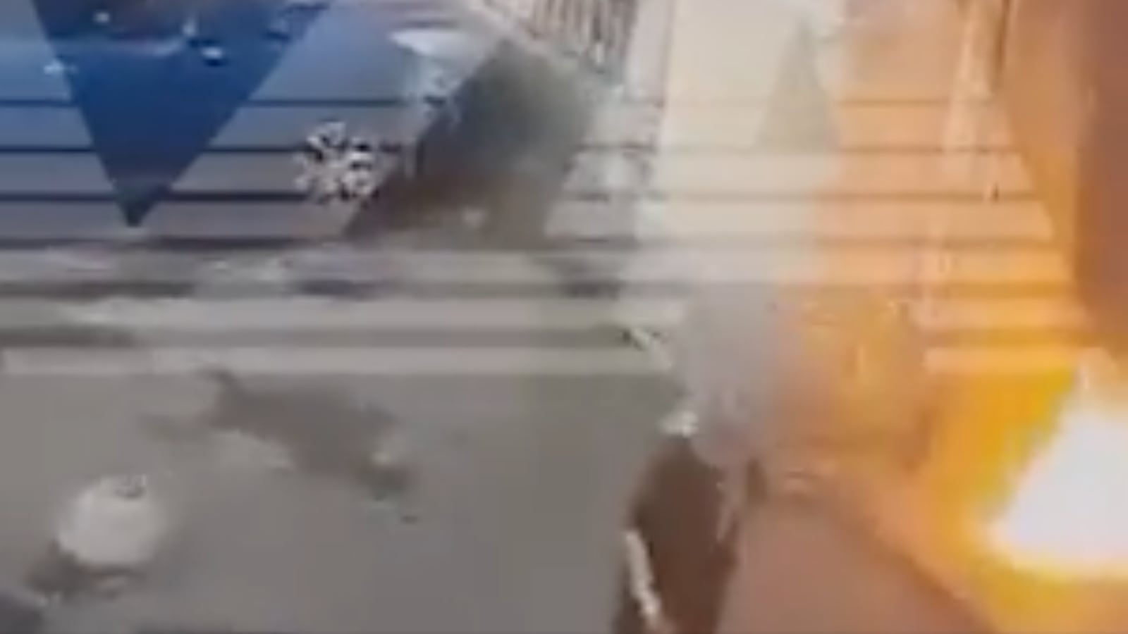 A woman setting fire to a military enlistment office in St. Petersburg, Russia, after claiming to have been targeted by a scammer.