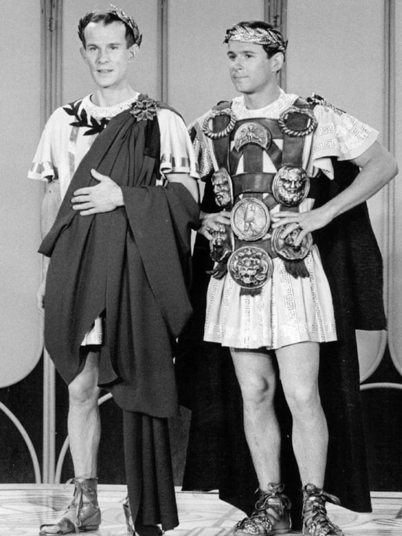 The Smother Brothers in black and white dressed as Romans