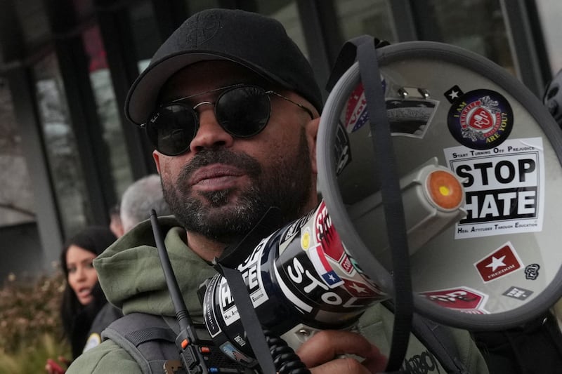 Former national chairman of the Proud Boys, Enrique Tarrio, holds a megaphone following a march from The Ellipse to the U.S. Capitol in memory of those who died on, or in the aftermath, of the January 6, 2021 attack on the U.S. Capitol, on the fifth anniversary of the attack in Washington, D.C.