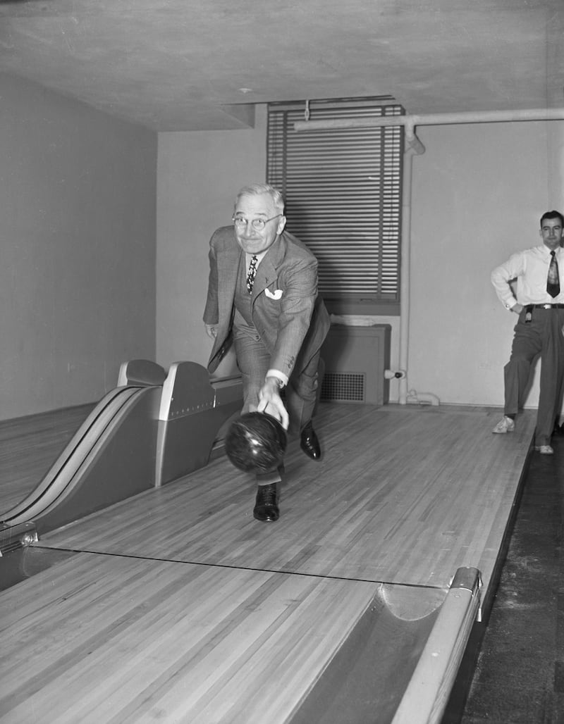 4/19/48-Washington, DC: Harry S Truman, the Missouri Southpaw, followed form today when he inaugurated the newly-installed bowling alleys in the basement at the White House, and threw the first ball with his left arm, knocking down seven pins. The alleys were installed as a birthday gift to the President, but he likes pitching horseshoes better.