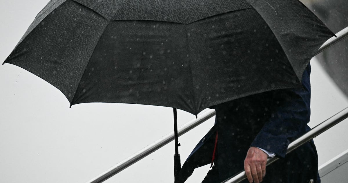 Trump, 80, Grips to Umbrella in Wobbly Air Force One Descent