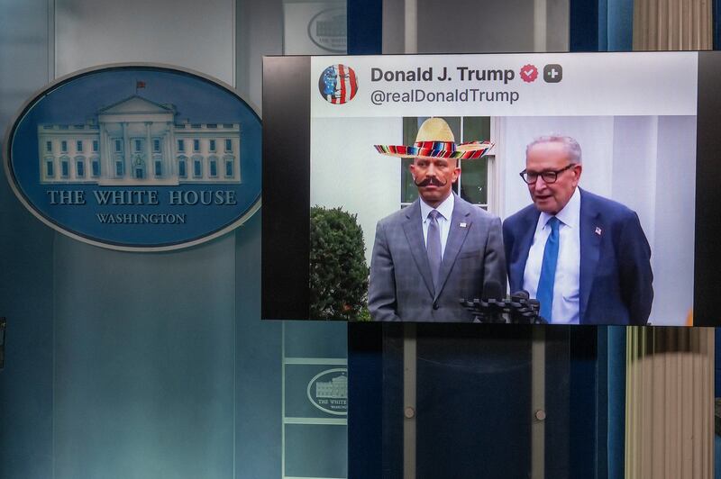 An AI-generated fake video of Democratic politicians Hakeem Jeffries and Chuck Schumer which was shared on President Donald Trump's Truth Social account plays in the White House Briefing Room at the White House in Washington D.C. on October 1, 2025.