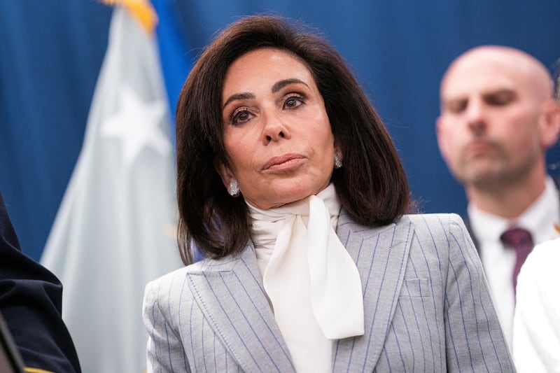 U.S. Attorney for the District of Columbia Jeanine Pirro looks on while announcing charges in connection with an international car theft ring during a press conference at the Justice Department in Washington, D.C., U.S., April 22, 2026. REUTERS/Nathan Howard