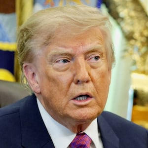 U.S. President Donald Trump holds an executive order renaming Lake Ontario as Lake America after signing it at the Oval Office of the White House in Washington, D.C., U.S., August 27, 2026. REUTERS/Evan Vucci