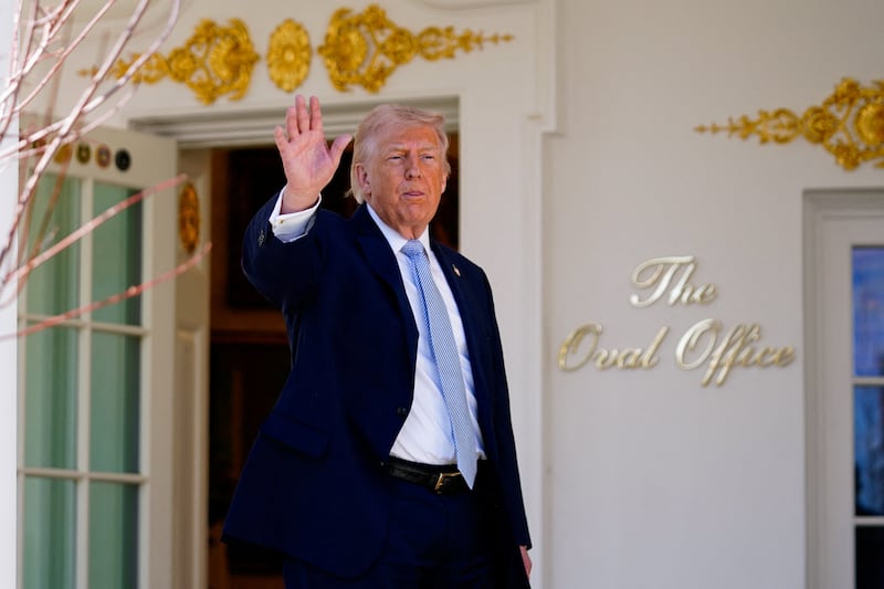 U.S. President Donald Trump gestures, as he heads back to the Oval Office, on the day of the 2026 White House Easter Egg Roll, in Washington, D.C., U.S., April 6, 2026. REUTERS/Nathan Howard
