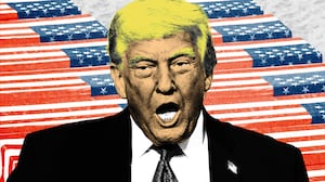 Donald Trump in front of coffins draped with American flags