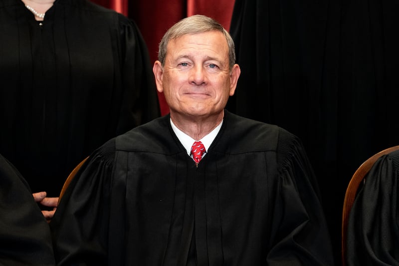 Chief Justice John Roberts sits during a group photo of the Justices at the Supreme Court in Washington, DC on April 23, 2021.