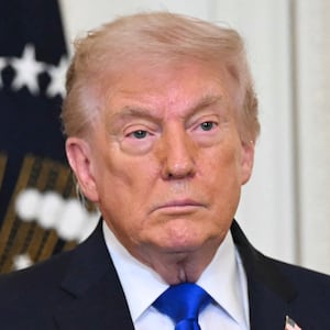 US President Donald Trump looks on during the Angel Families Remembrance Ceremony in the East Room of the White House in Washington, DC, on February 23, 2026. (Photo by SAUL LOEB / AFP via Getty Images)