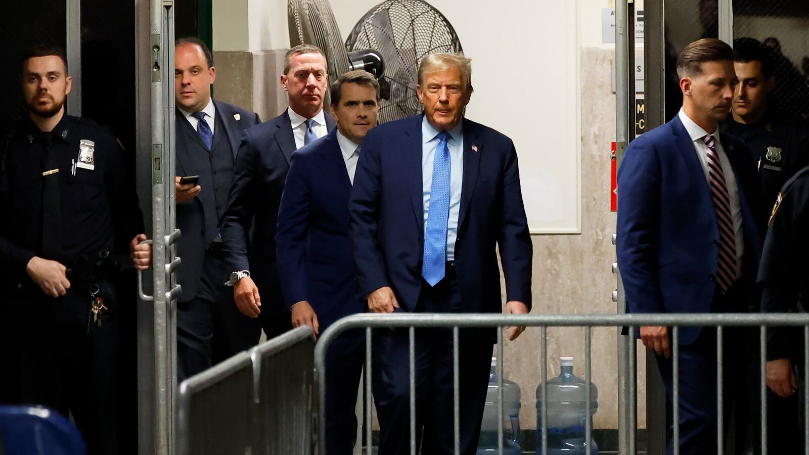 Former president Donald Trump returns to the courtroom after a short break during his hush money trial.