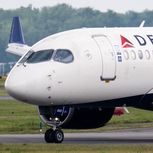 A Delta Air Lines Airbus A220 airplane prepares to takeoff at Ronald Reagan Washington National Airport in Arlington, Virginia, on July 10, 2025. Delta Air Lines stock shares surged more than 11 percent in early trading on Thursday,  as the airline reported better-than-expected results. Between April and June, the group posted year-on-year sales of $16.65 billion and net income of $2.13 billion (+63% year-on-year). (Photo by SAUL LOEB / AFP) (Photo by SAUL LOEB/AFP via Getty Images)