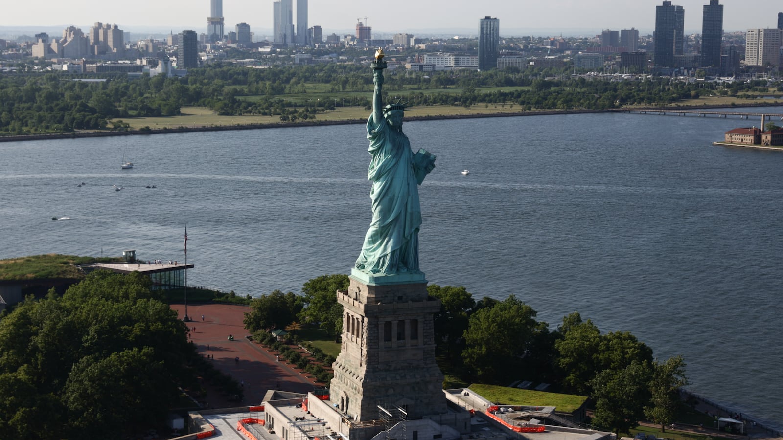 An aerial view of Statue of Liberty and New York Harbor in New York City, United States