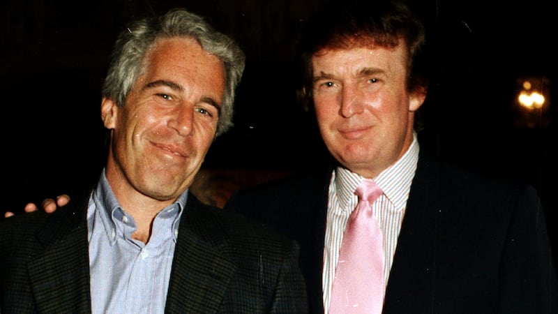 Jeffrey Epstein (left) and Donald Trump pose together at the Mar-a-Lago estate, Palm Beach, Florida on February 22, 1997.