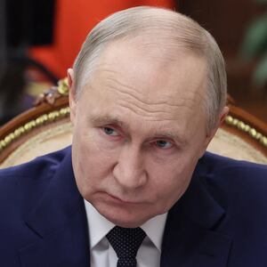 In this pool photograph distributed by the Russian state agency Sputnik, Russia's President Vladimir Putin meets with Russian Minister of Natural Resources and Ecology at the Kremlin in Moscow on June 3, 2025.