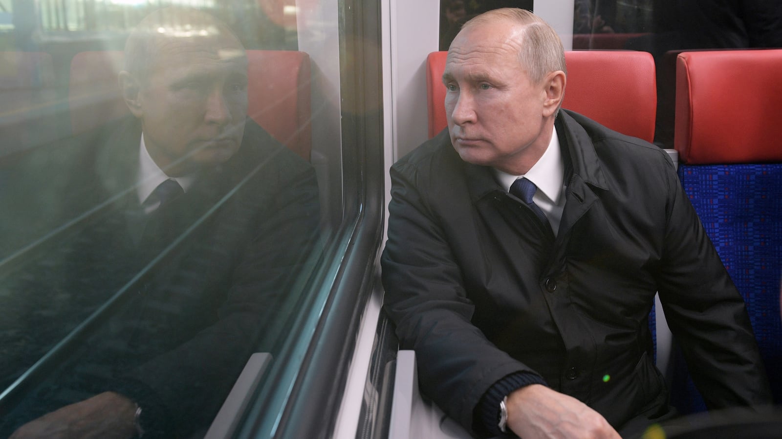 Vladimir Putin looks out the window of a new train as he takes part in the launch of the Moscow Central Diameters network in Moscow, Russia, Nov. 21, 2019.