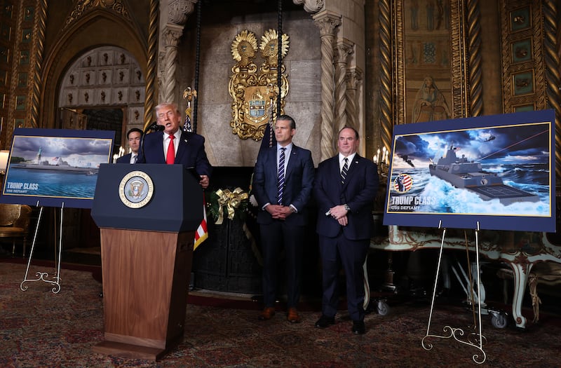 Trump, joined by Secretary of State Marco Rubio (L), Secretary of War Pete Hegseth, and Secretary of the Navy John Phelan.