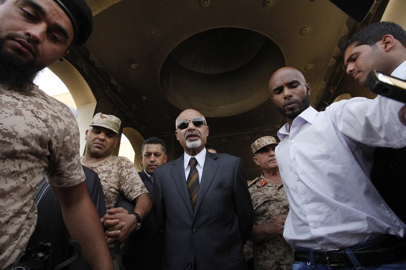 articles/2012/09/18/libya-s-inferno-u-s-and-libyan-officials-investigate-bengazhi-assault/libya-us-government-meet-dettmer_m6yvfb