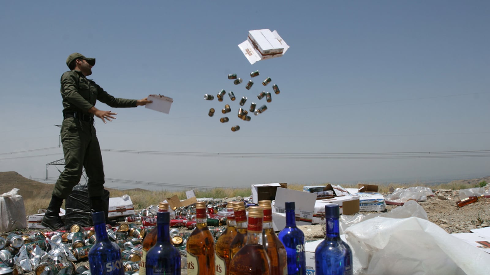 articles/2012/06/27/death-sentence-marks-latest-battle-in-iran-s-culture-war/iran-alcohol-confiscation-memarian_dcrkit