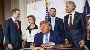 WASHINGTON, DC - SEPTEMBER 29: U.S. President Donald Trump signs an executive order during the America.gov launch event at Andrew W. Mellon Auditorium on September 29, 2026 in Washington, DC. The website features an artificial intelligence tool to help Americans interact with the federal government. The event was attended by tech leaders Elon Musk, Nvidia CEO Jensen Huang and Blue Origin CEO Dave Limp, along with U.S. Vice President JD Vance and U.S. Secretary of State Marco Rubio. (Photo by Kevin Dietsch/Getty Images)