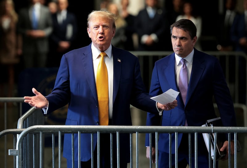 Former U.S. President Donald Trump speaks to members of the media next to his attorney Todd Blanche amid Trump's trial for allegedly covering up hush money payments, at Manhattan Criminal Court on May 7, 2024, in New York City, U.S. Trump has been charged with 34 counts of falsifying business records, which prosecutors say was an effort to hide a potential sex scandal, both before and after the 2016 presidential election. Trump is the first former U.S. president to face trial on criminal charges.