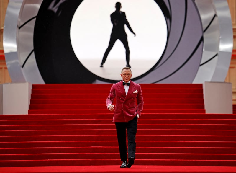 English actor Daniel Craig walks on the red carpet after arriving to attend the World Premiere of the James Bond 007 film "No Time to Die
