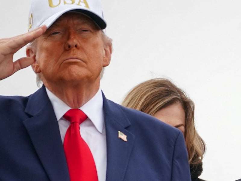 U.S. Special Envoy Steve Witkoff stands behind President Donald Trump and first lady Melania Trump during the transfer of the remains of six U.S. Army service members who were killed in Kuwait.