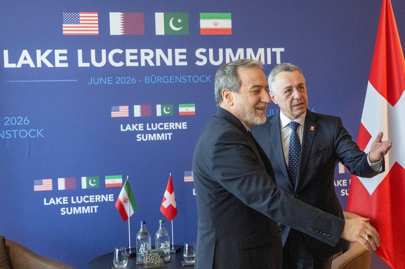 Minister of Foreign Affairs of Iran, Seyyed Abbas Araghchi, and Swiss Federal Council member, Ignazio Cassis, right, at bilateral discussions at the Burgenstock resort in Obburgen, near Lucerne, Switzerland, Sunday, June 21, 2026. URS FLUEELER/Pool via REUTERS