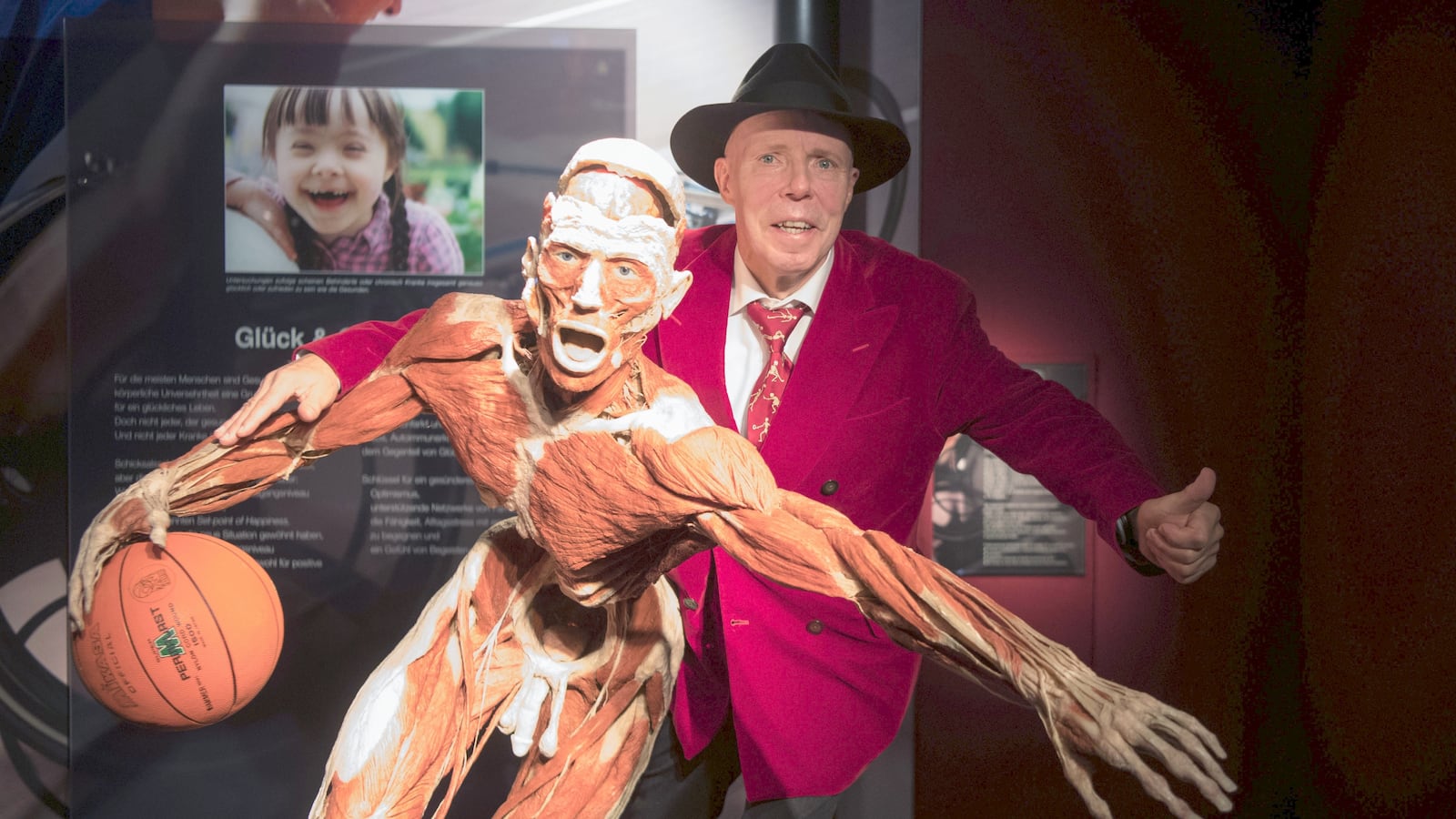 Anatomist Gunther von Hagens stands behind a full-body plastination at a permanent exhibition at the Altes Hallenbad in Heidelberg, Germany, 27 September 2017.