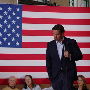 Republican presidential candidate and Florida Governor Ron DeSantis listens to a question from the audience at a campaign town hall meeting in Newport, New Hampshire.