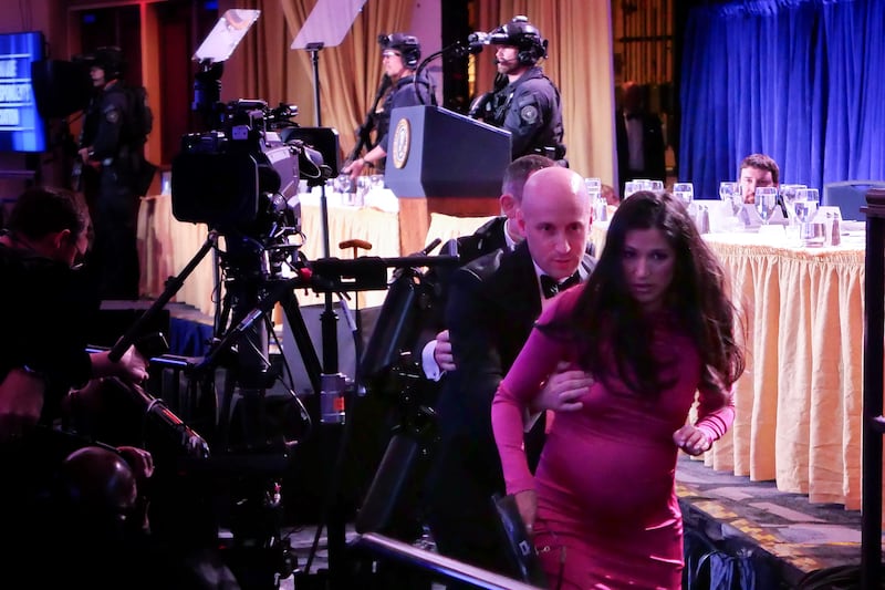 Stephen Miller helps his wife Katie Miller are seen after an incident at the annual White House Correspondents Association Dinner April 25, 2026 in Washington, DC.