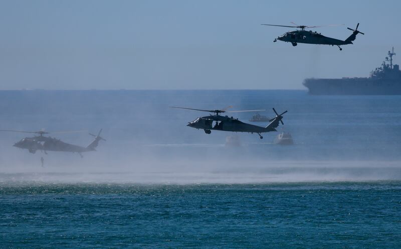 OCEANSIDE, CALIFORNIA - OCTOBER 18: A team of U.S. Navy SEALS drop into the water from UH-1 Venoms during the America's Marines 250 event at Camp Pendleton's Red Beach on October 18, 2025 in Oceanside, California. The U.S. Marines are marking their 250th anniversary with a live amphibious assault demonstration entitled "Sea To Shore--A Review of Amphibious Strength" and visits from Vice President JD Vance and War Secretary Pete Hegseth. (Photo by Mario Tama/Getty Images)