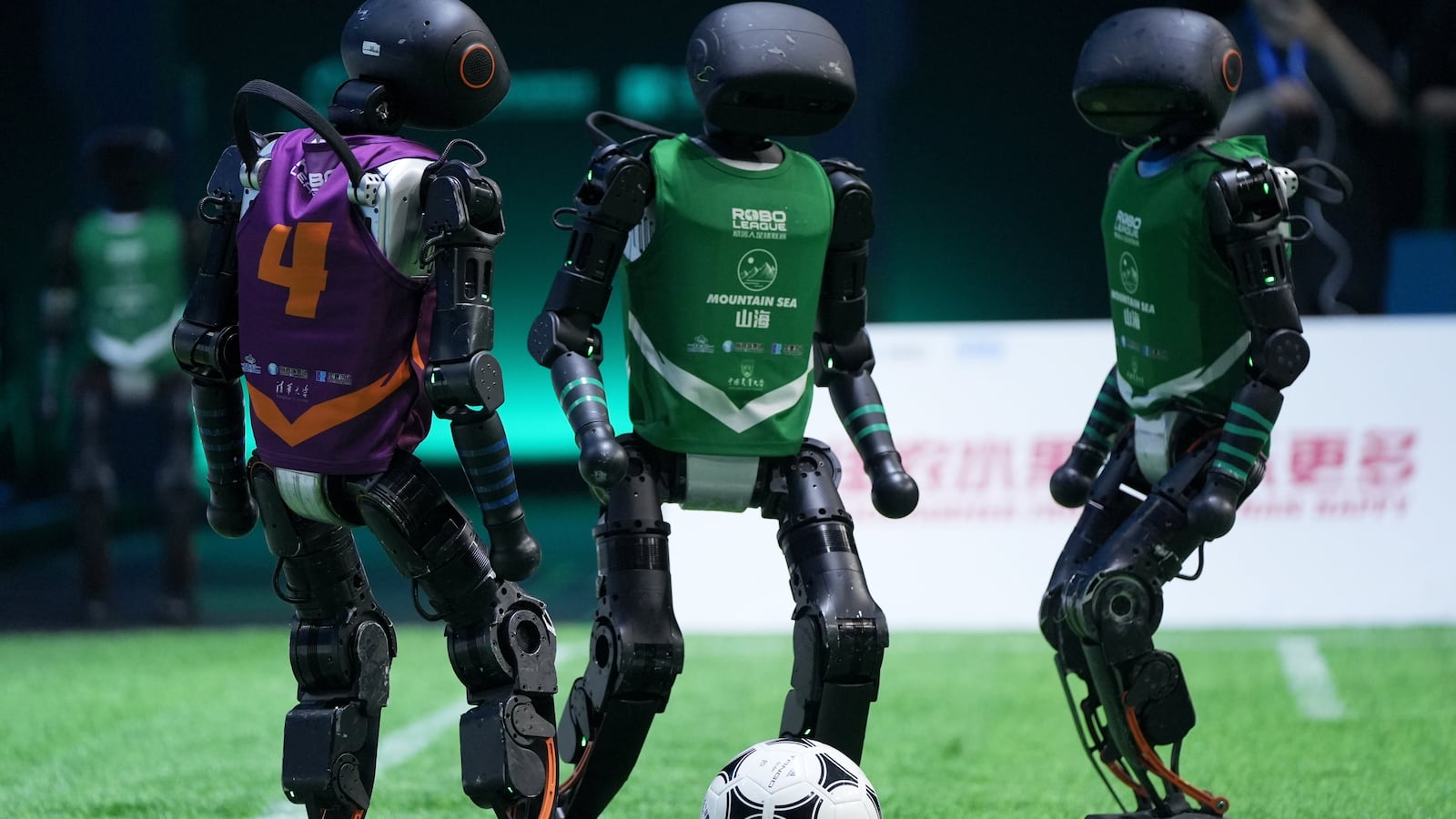 Robots play soccer.